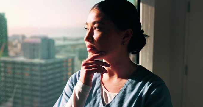 Thinking, nurse and woman by window in hospital, shift reflection and perspective for patient empathy. Calm, healthcare professional and Asian person with idea for medical care, vision and planning