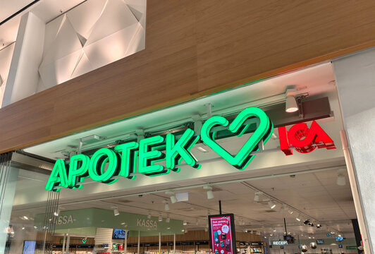 Gothenburg, Sweden-Nov.24th 2025: Low angle view of the green sign of Apotek Hjartat pharmacy
