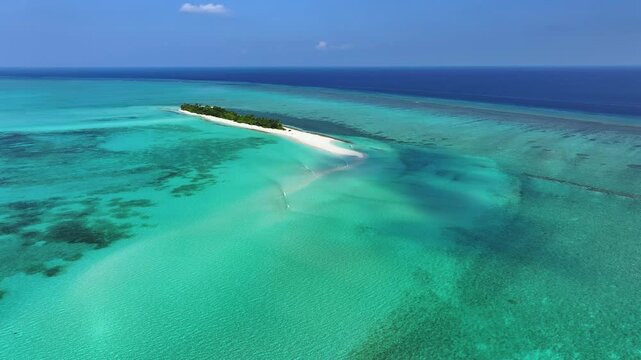 Aerial view of the tropical island of Fulhadhoo with white sand beaches and turquoise coral reefs in the Indian Ocean, Fulhadhoo, Baa Atoll, Maldives.