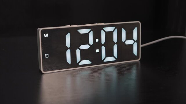 High-quality sound recording in uncompressed WAV format of an electronic alarm clock with a large digital display as the alarm goes off and starts beeping for Foley and editing use.