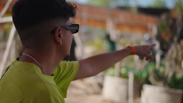 Young man pointing at elephant in a sanctuary