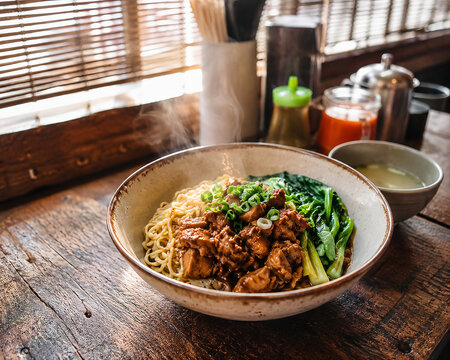 Steaming Indonesian mie ayam noodle soup in rustic ceramic bowl at traditional street warung, warm morning light