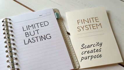 Naklejka premium Thought-provoking message about value and purpose in a finite system highlighted in a notebook setting with inspiring words