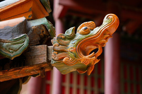 Glazed ceramic dragon ornament on a wooden roof eave of the suspended temple Xuankong Si near Datong, Shanxi, China