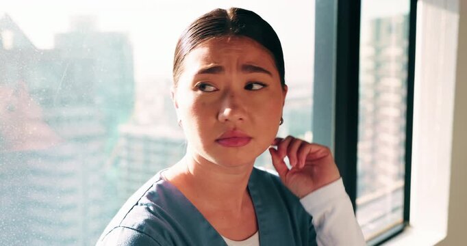 Woman, nurse and thinking by window with grief, fatigue or mistake in hospital. Mental health, sad physician and medical person with healthcare, anxiety and stress for loss or surgery fail in clinic