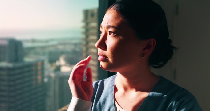 Thinking, worry or nurse by window in hospital, shift reflection or medicine mistake for patient. Concerned, healthcare worker or Asian woman with treatment error for medical care, vision or stress
