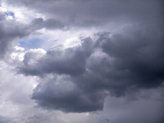 Dark storm clouds gathering with small blue sky appearing © Sergej