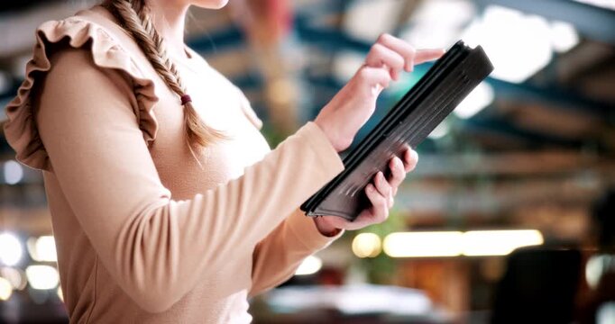 Student, hands and typing in college with tablet, online research and check enrollment for course. Bokeh, woman browse or scroll in university with tech, learning or registration for higher education