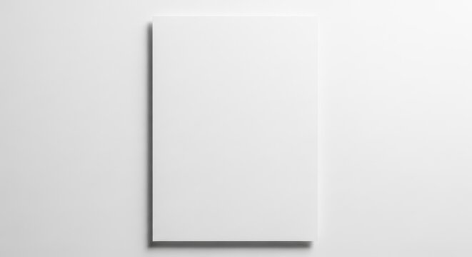 A clean, blank sheet of white paper lying flat on a subtle, shadowed surface, ready for creative use