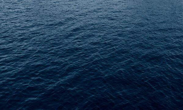 Ocean surface dark blue water background 