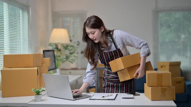 Online seller working with cardboard boxes