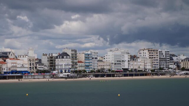 View of the beach at Les Sables d'Olonne under a threatening sky, Vendee, France