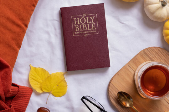 Holy Bible and autumn cozy decor top view. Bible study fall concept