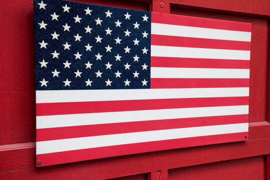 American flag on red painted wall