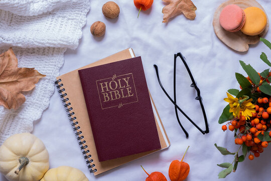 Holy Bible and autumn cozy decor top view. Bible study fall concept