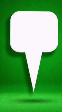 Blank White Speech Bubble on Vibrant Green Background - A clean, white speech bubble with rounded corners and a pointed tail floats in the center against a textured, vibrant green background.
