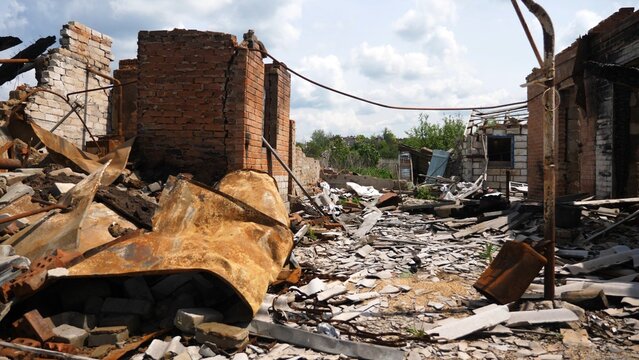 View to destroyed residential buildings at Kharkivska oblast. Ruined houses after bomb attacks on ukrainian territory from russia army. Consequences of russian invasion of Ukraine. Slow motion