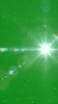 Bright Glitch Effect on Green Screen - This video features a vibrant green screen background with a bright, starburst-like lens flare emanating from the center.