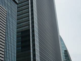 Obraz premium Modern Office Building Against Blue Sky, Clean Urban Architecture Background