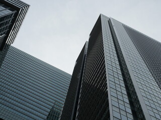 Glass Office Building Under Clear Blue Sky, Modern City Architecture Background © SoftFlower
