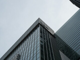 Glass Office Building Under Clear Blue Sky, Modern City Architecture Background © SoftFlower