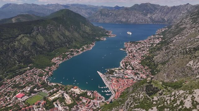 Kotor Montenegro 4K Aerial Video, Wide Angle Drone Push Forward and Yaw Left over San Giovanni Kotor Fortress Stone Walls revealing Panoramic Fjord and Old Town View