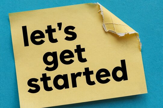 "Motivational 'Let's Get Started' Sticky Note on Blue Background for Business or Productivity Themes"