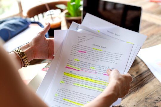 Editing documents on wooden table