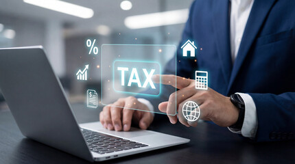 Fototapeta premium Businessman managing tax returns and financial planning through digital interface on laptop