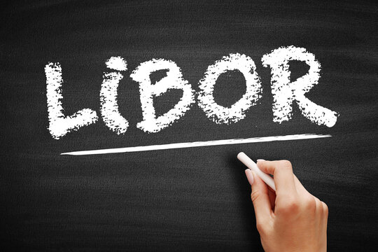 LIBOR London interbank offered rate acronym on a chalkboard. Hand underlining the financial benchmark for global interest rates, banking, and economic studies.
