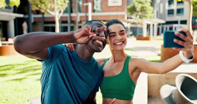 Fitness, interracial couple and smile in city for selfie, love and social media for wellness. Man, woman and profile picture in urban town for exercise, memory and bonding for health or development