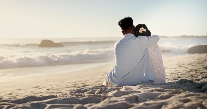 Hug, black couple and kiss on holiday at beach for anniversary getaway, bonding and connection. Back, love and happy people with affection on sand for romantic vacation, trust or healthy relationship