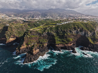 Fototapeta premium Aerial drone footage of the stunning coastal cliffs of Santa Ursula in North Tenerife, Spain, overlooking the Atlantic Ocean