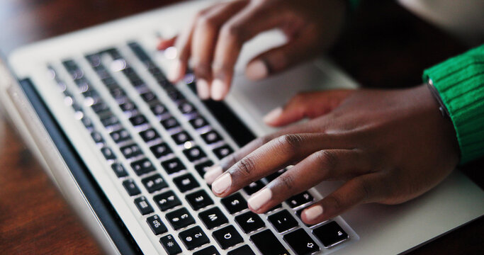 Closeup of Hands Typing on Laptop Keyboard for Remote Work and Productivity Stock Photo