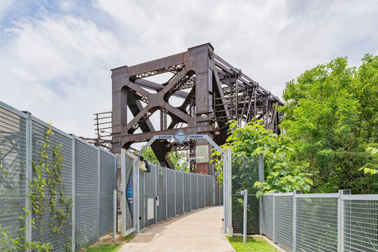 Pedestrian walkway entrance to historic steel truss bridge in Memphis