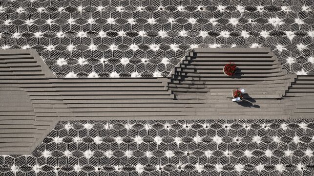 Aerial view of modern architectural concrete plaza with stairs.