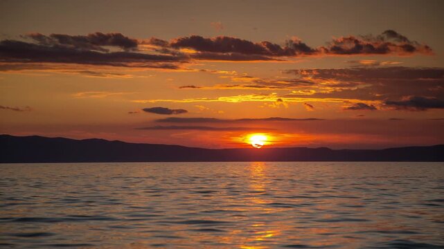 Stunning sunset seen from the sea
Stunning orange sunset seen from the sea.