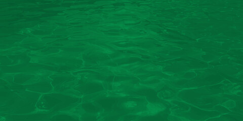 Abstract green water ripples background with soft light reflection emerald liquid surface texture for design © Jharna Akter