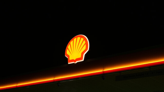 Leicester, England, UK - 4 May 2026: Shell gas station logo at night, glowing petrol station sign, fuel company branding icon on dark background, oil industry editorial photography