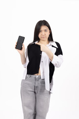 Fototapeta premium Happy young woman holding her smartphone with a cheerful smile