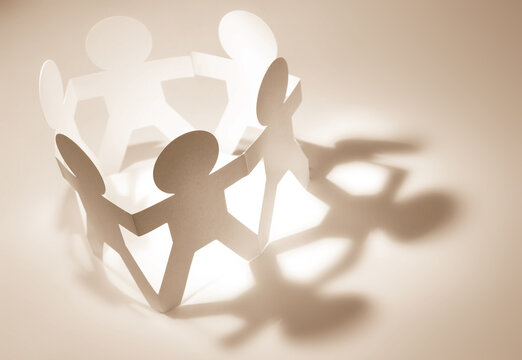Paper chain team holding hands