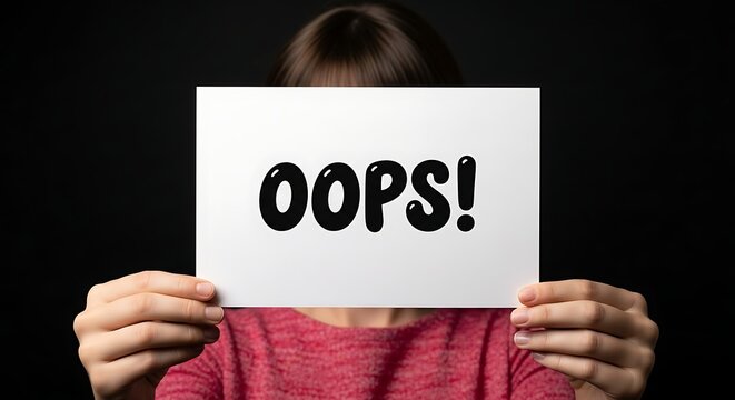Person holding a white sign with the word oops written on it against a dark background
