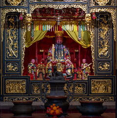 Fototapeta premium Macau, China : richly decorated altar inside a traditional Chinese temple in the historic center of Macau.