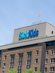 Naklejka premium Toronto, Ontario, Canada - June 2, 2026: SickKids sign on the building of the Hospital for Sick Children (SickKids) in Toronto, Ontario, Canada. 