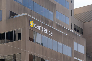 Naklejka premium Toronto, Ontario, Canada - June 2, 2026: Cancer ca sign on the headquarters of the Canadian Cancer Society building on St Clair Avenue West in Toronto, Ontario, Canada. 