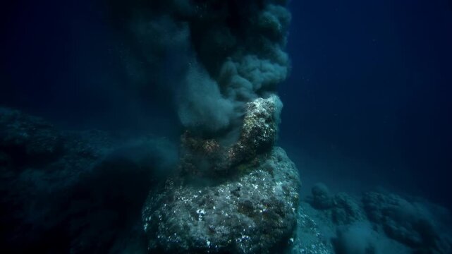 Bubbling underwater volcano explodes with smoke and steam under the ocean
