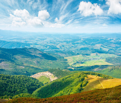 mountainous countryside scenery in the afternoon. view of cloudy sky above the valley. colorful meadows and trees on hill in dappled light. beautiful nature scenery of carpathians. remote outdoors