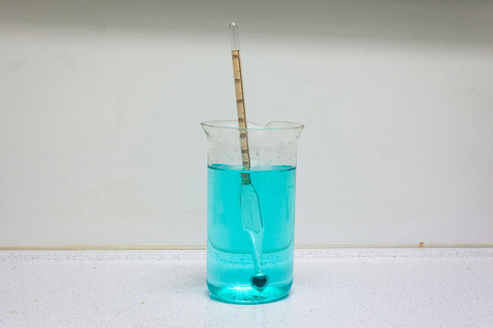 Aerometer in a glass with liquid, an aerometer is an instrument designed to measure the density.