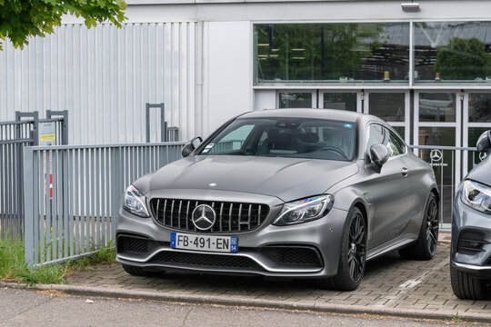 Nancy, France - May 7th 2026 : View on a matte grey Mercedes-AMG C63 Coup&eacute; parked on a street. The Mercedes-Benz C-Class is a series of compact executive cars produced by Mercedes-Benz Group AG.