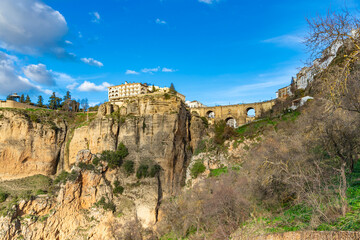 Fototapeta premium View of the historic Puente Nuevo (New Bridge), stone bridge spanning El Tajo gorge above the Guadalevin River in Ronda, Malaga province, Andalusia, southern Spain